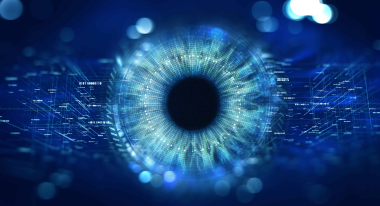 A striking digital eye composed of circuits and data streams, glowing in shades of blue — symbolizing vigilant surveillance and cyber‑awareness. This visual mirrors WALLIX’s commitment to continuous monitoring and proactive threat detection in privileged access security.